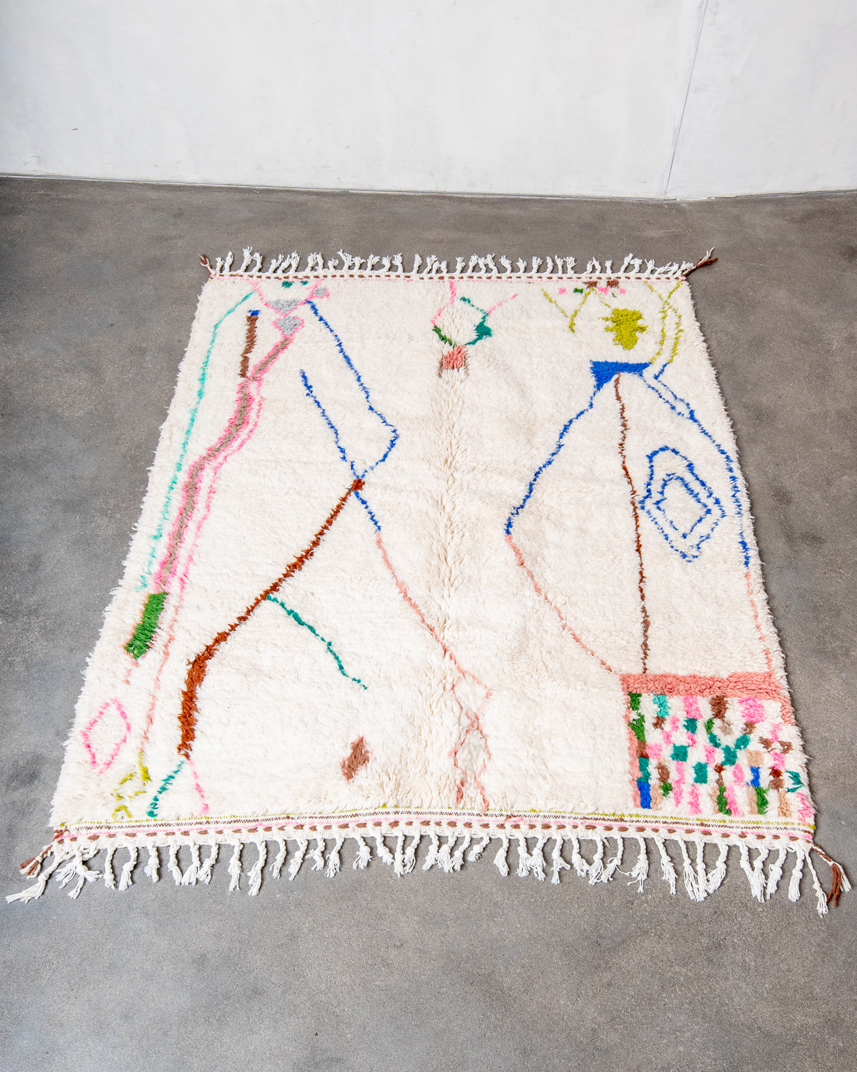 Modern, designer, handcrafted Berber rug from Morocco. Beniourain carpet with beautiful colours and patterns and fluffy wool texture.